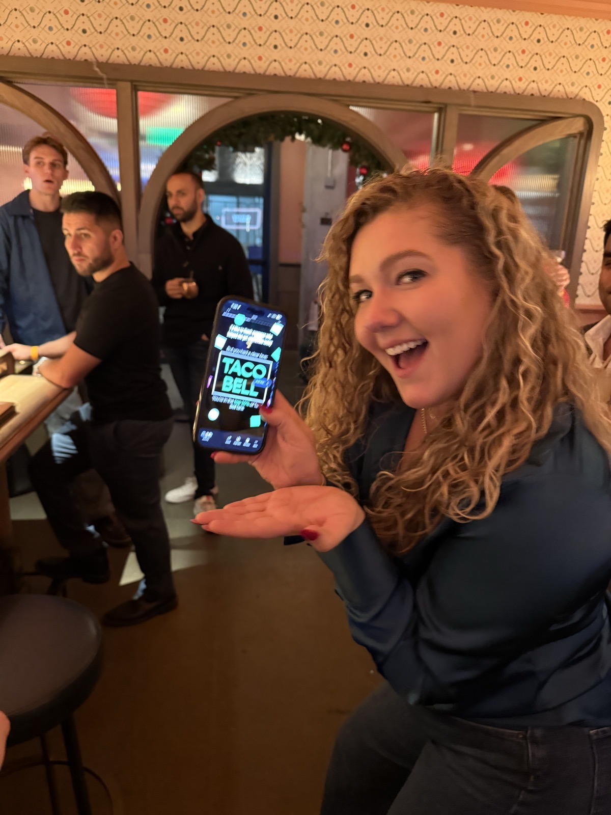 A Krew member sharing a Taco Bell find during a team night out