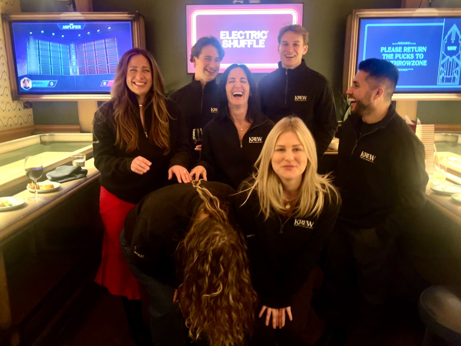 Krew members laughing together at Electric Shuffle